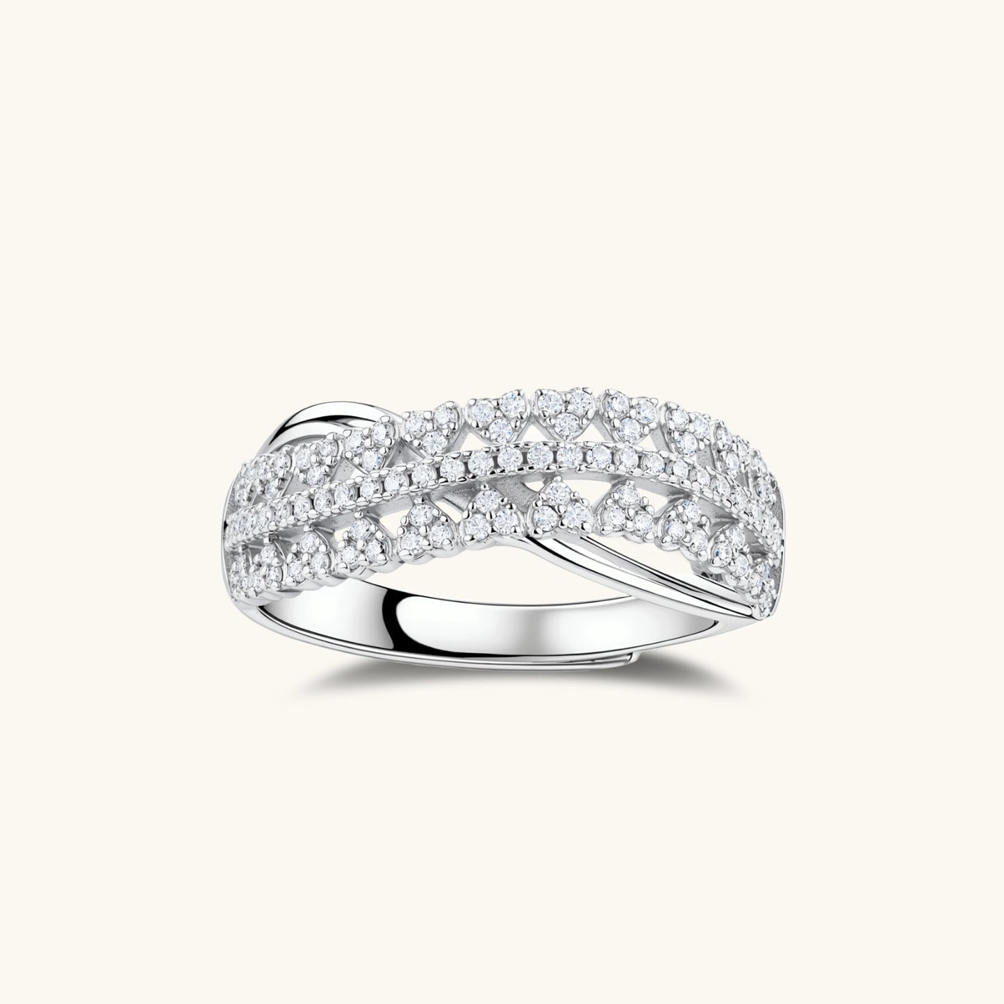 Sterling silver crossover ring with pavé-set moissanite stones creating an elegant infinity design on neutral background