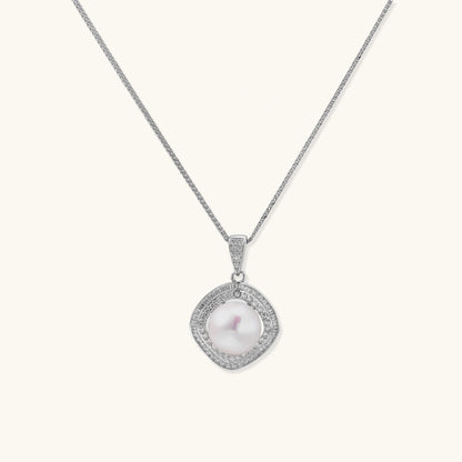 Cushion-shaped double halo pendant with 10mm freshwater pearl center on rhodium-plated sterling silver chain