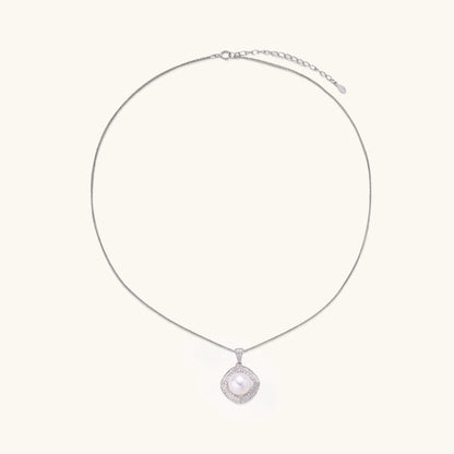 Cushion-shaped double halo pendant with 10mm freshwater pearl center on rhodium-plated sterling silver chain